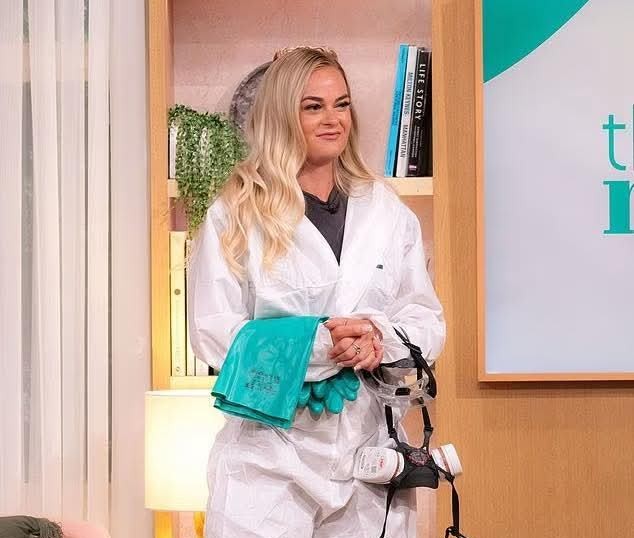 Lauren Baker carrying out a biohazard sweep in full PPE